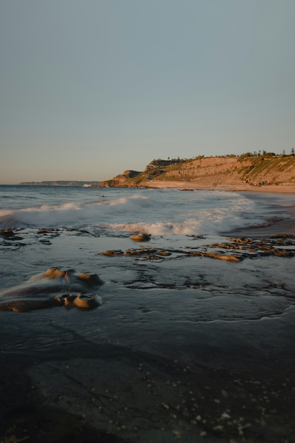 a rocky beach with waves crashing