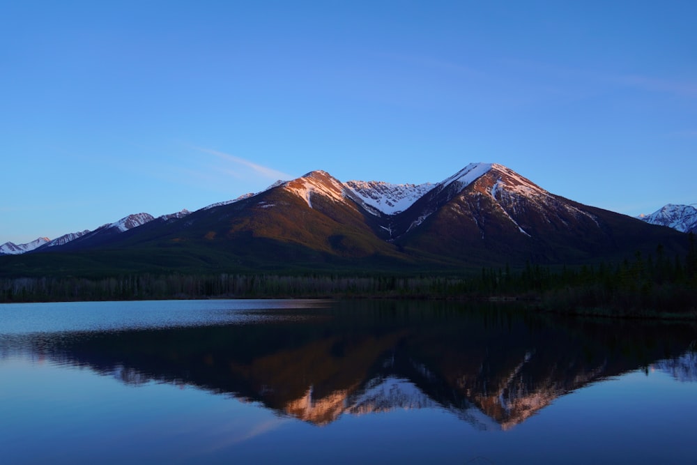 a lake with mountains in the background