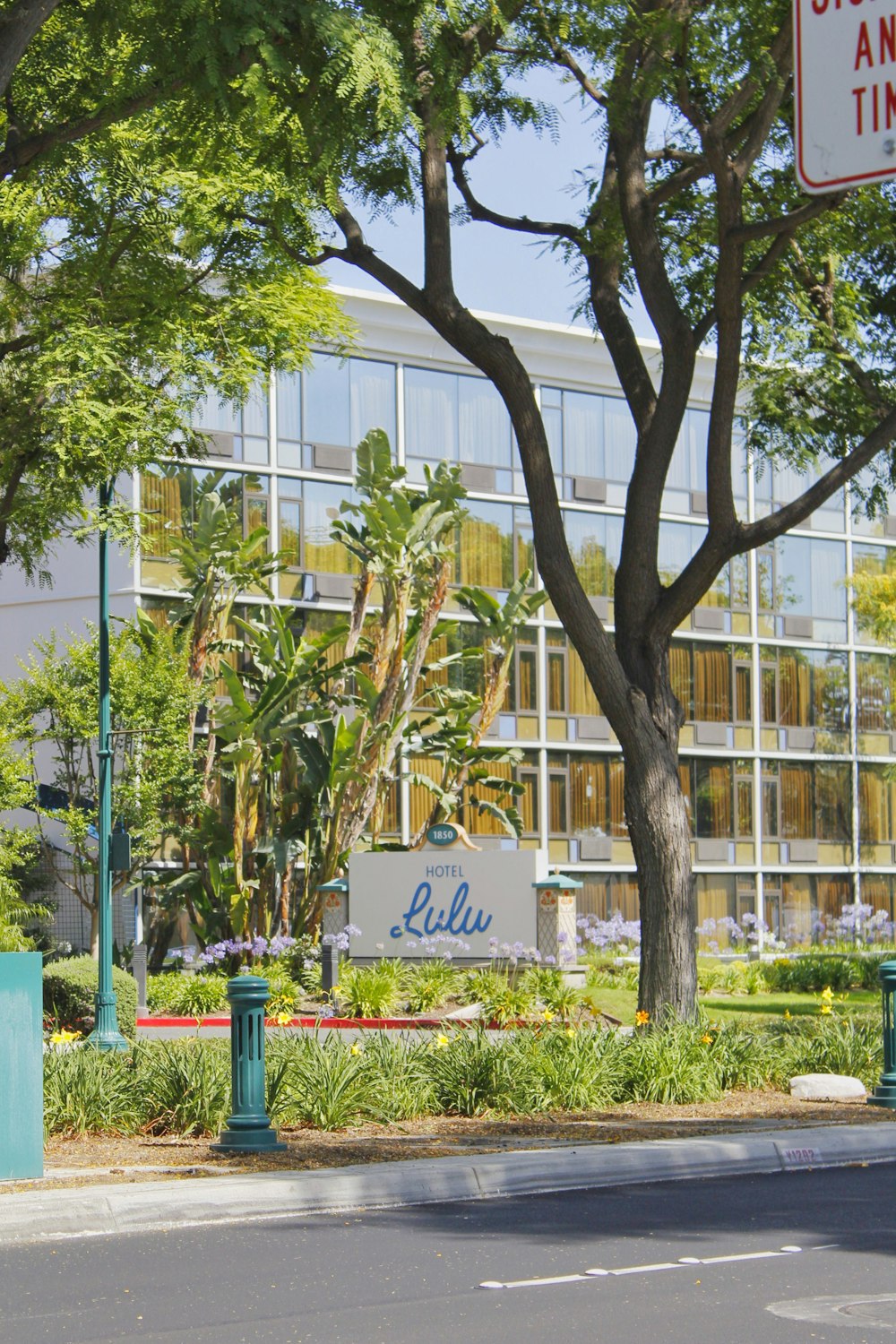 a building with trees and grass