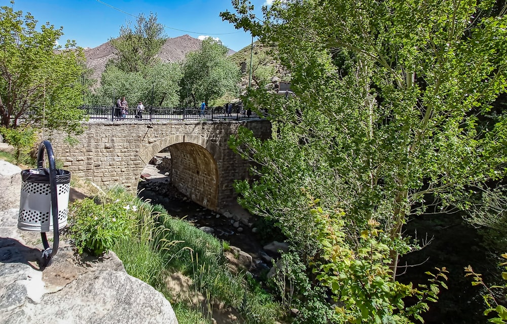 a stone bridge over a river