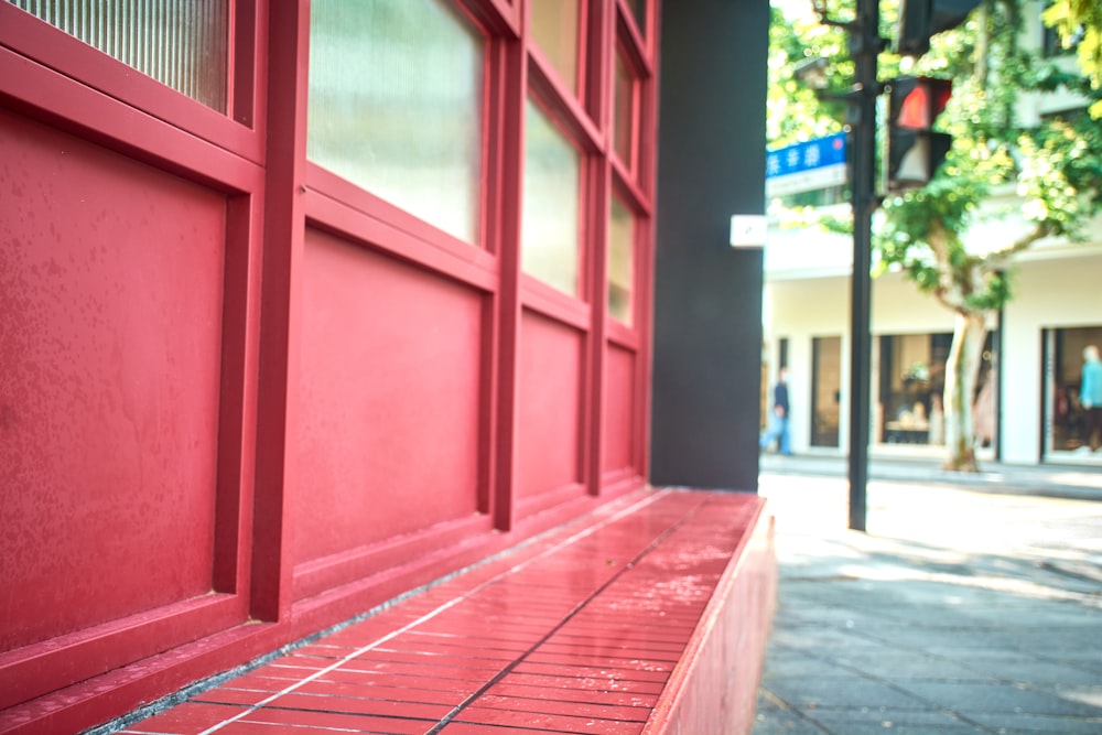 a red building with a street sign