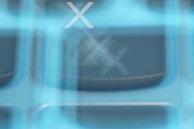 Abstract digital lock overlay on a blurred background of news articles.