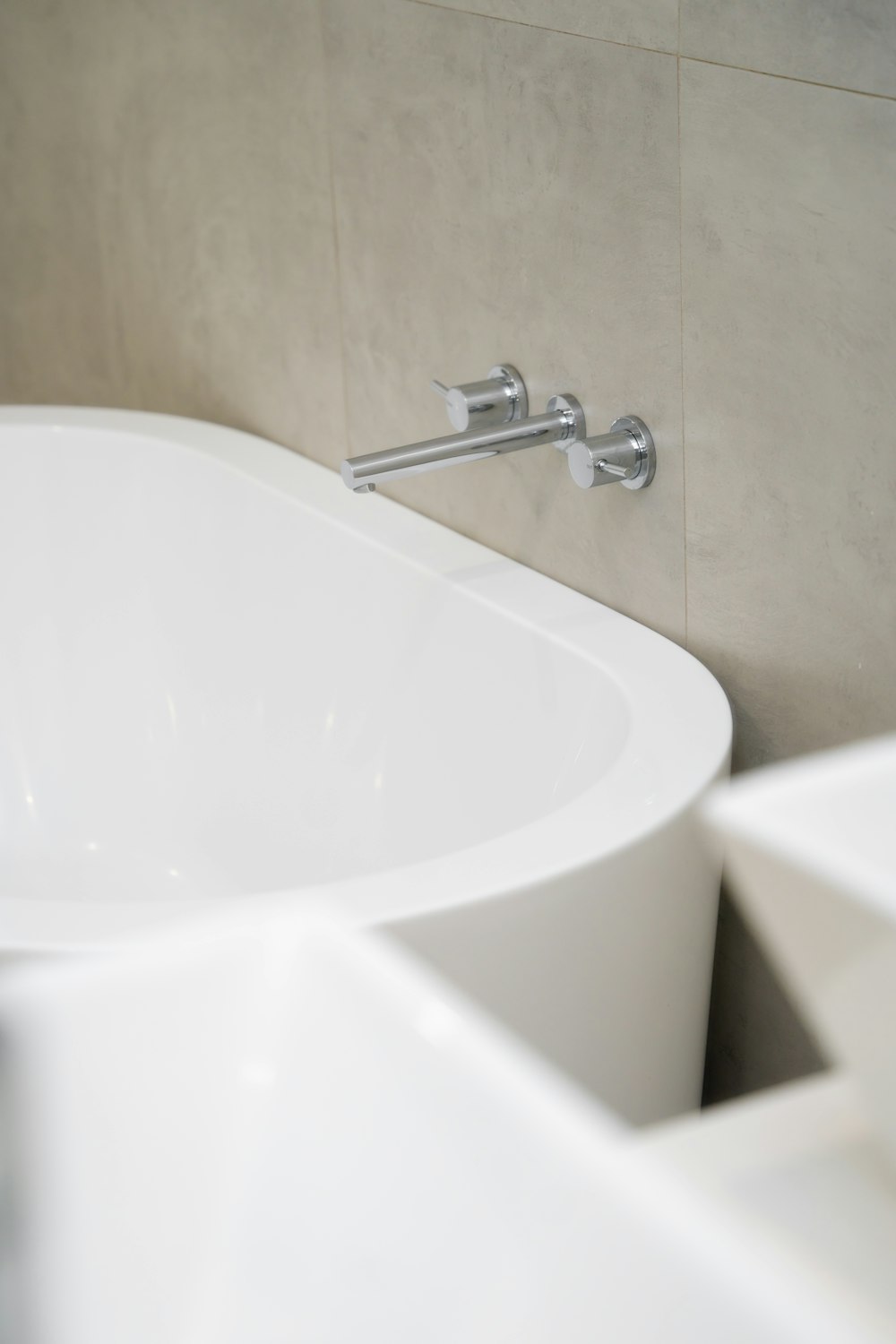 a white sink with a faucet