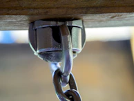 Close-up of metal hooks on hangers, showing their polished and durable build.