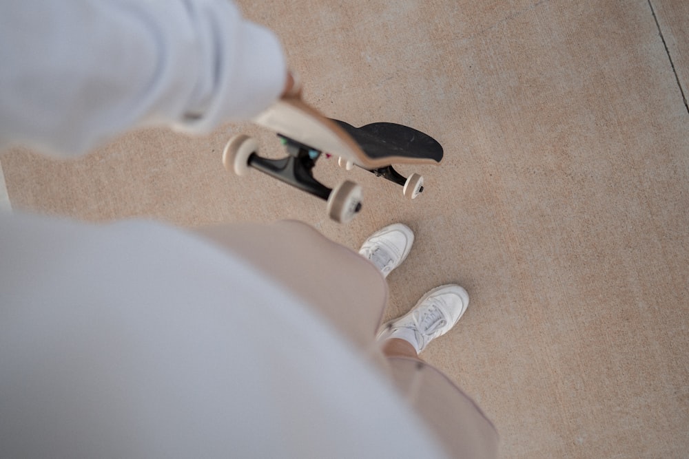 a person's feet with white shoes and white socks