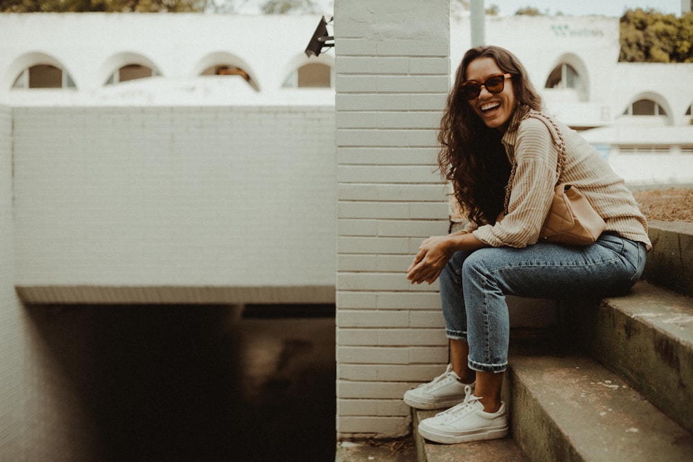 a person sitting on a ledge