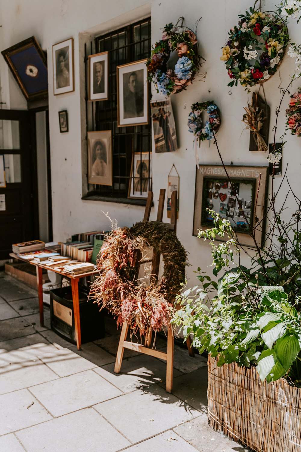 a skeleton in a room with pictures on the wall