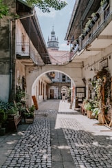 a stone street with buildings on both sides