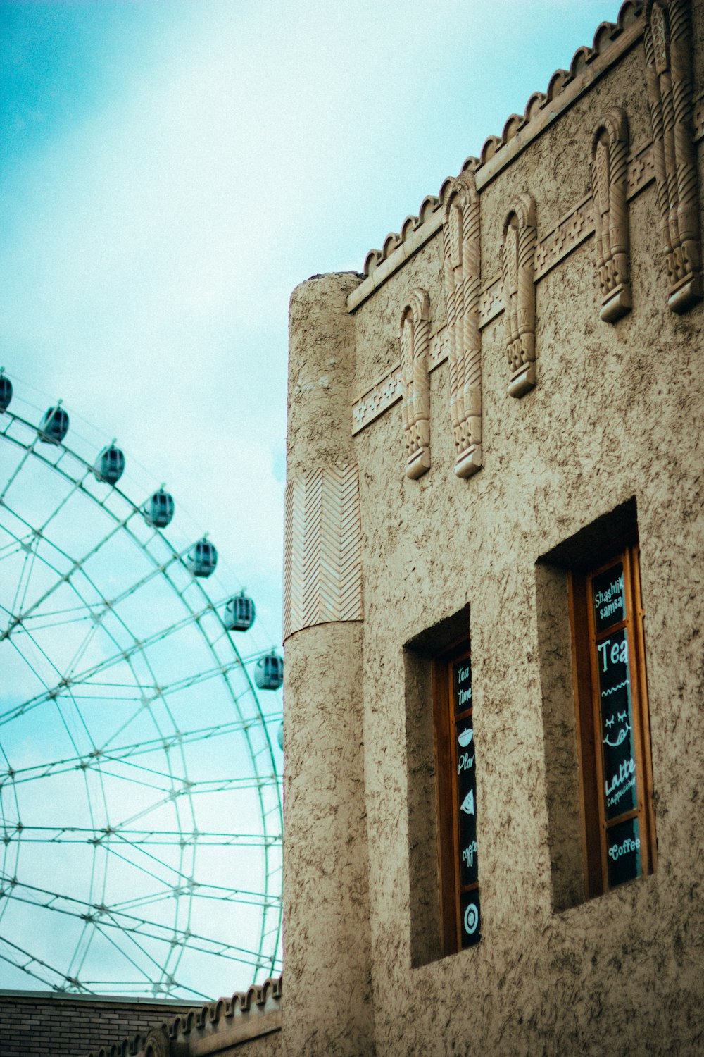 a building with a ferris wheel