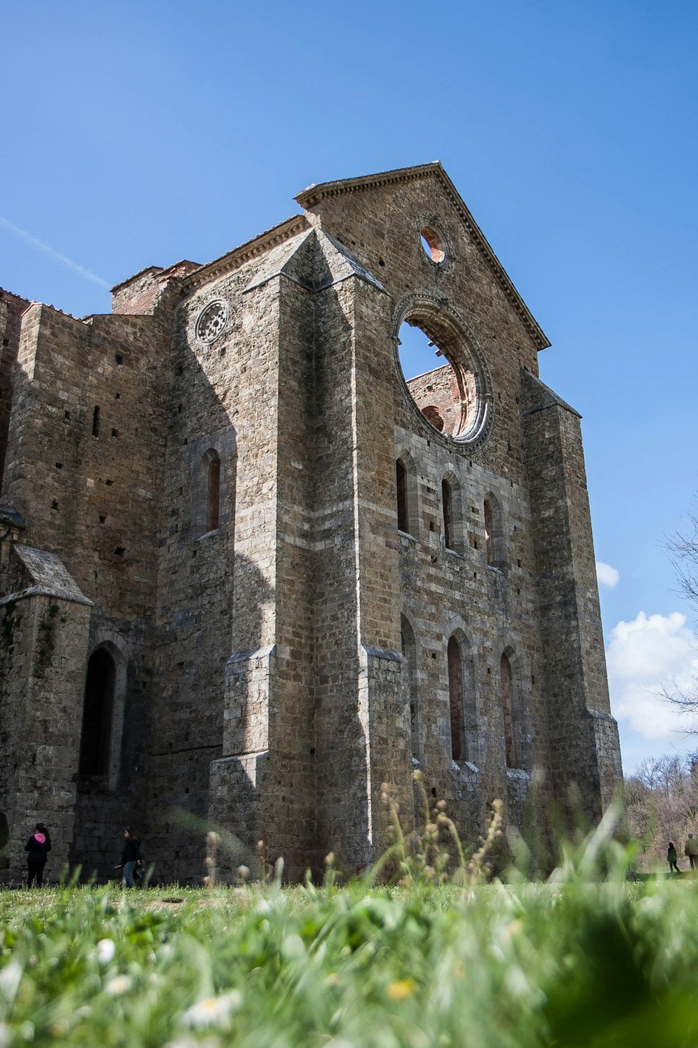 a stone building with a clock on it