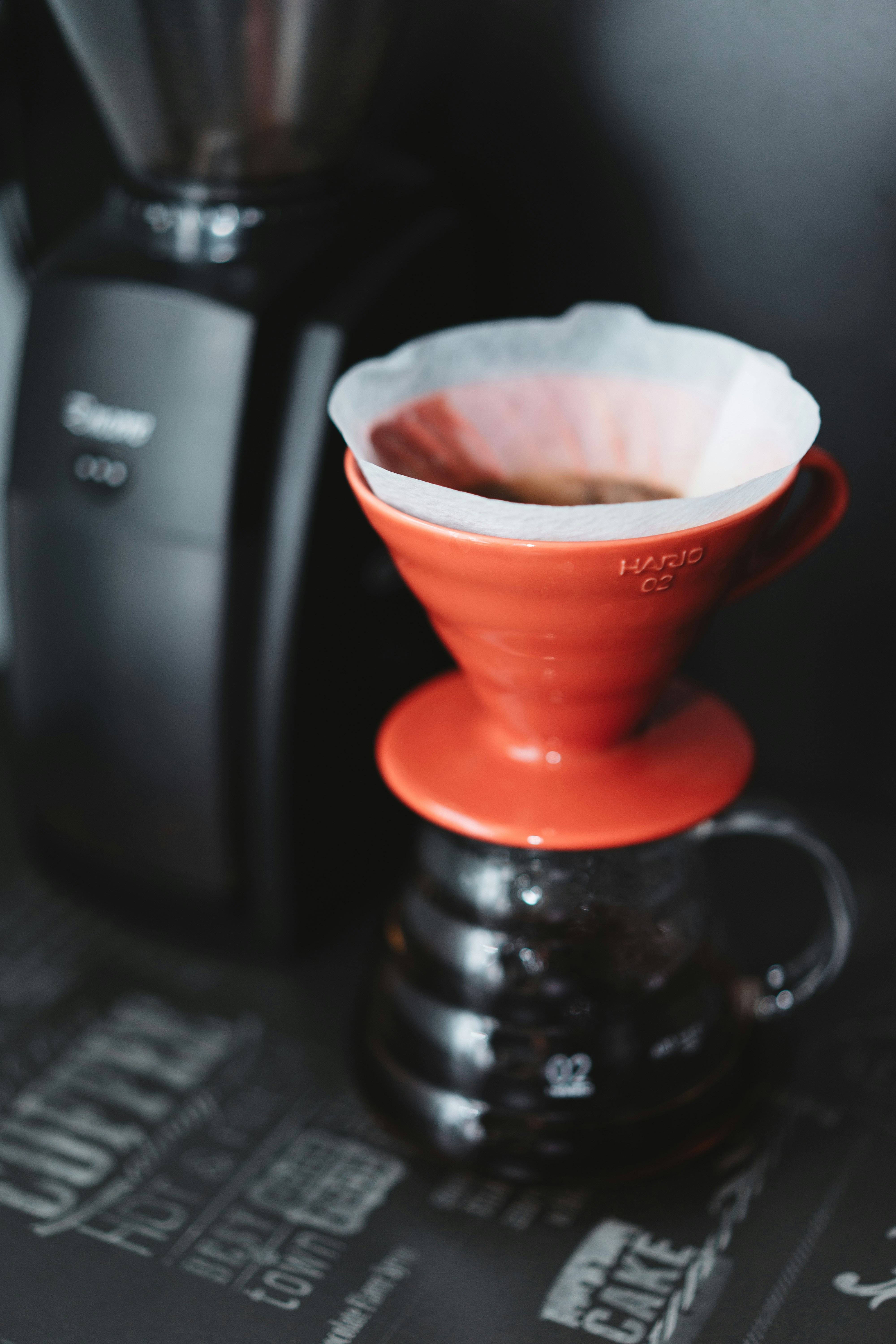a coffee maker with a cup of coffee