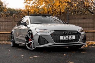 a silver car parked on a street