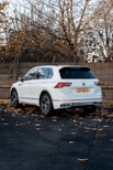 a white car parked on a street