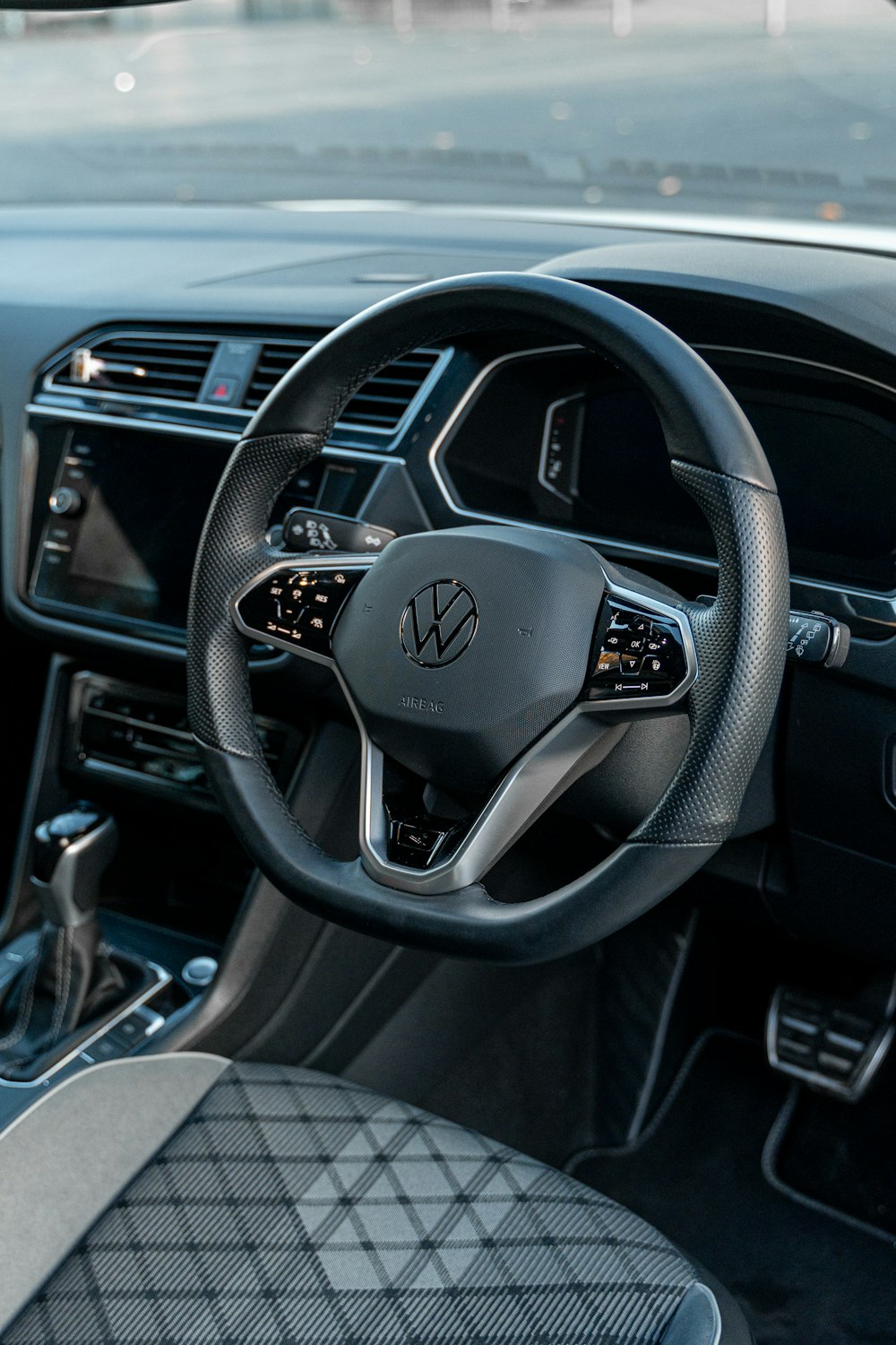 the steering wheel and dashboard of a car