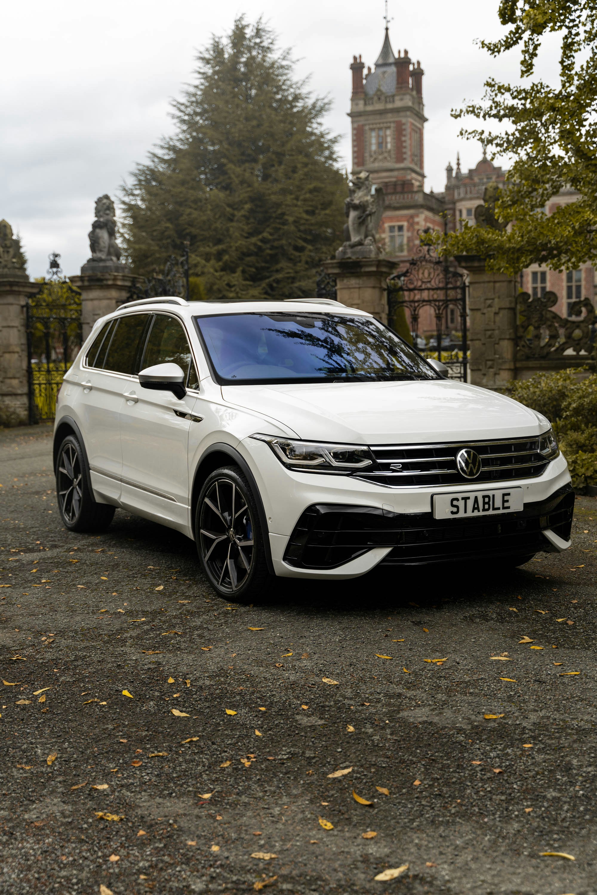 a white car parked in front of a building