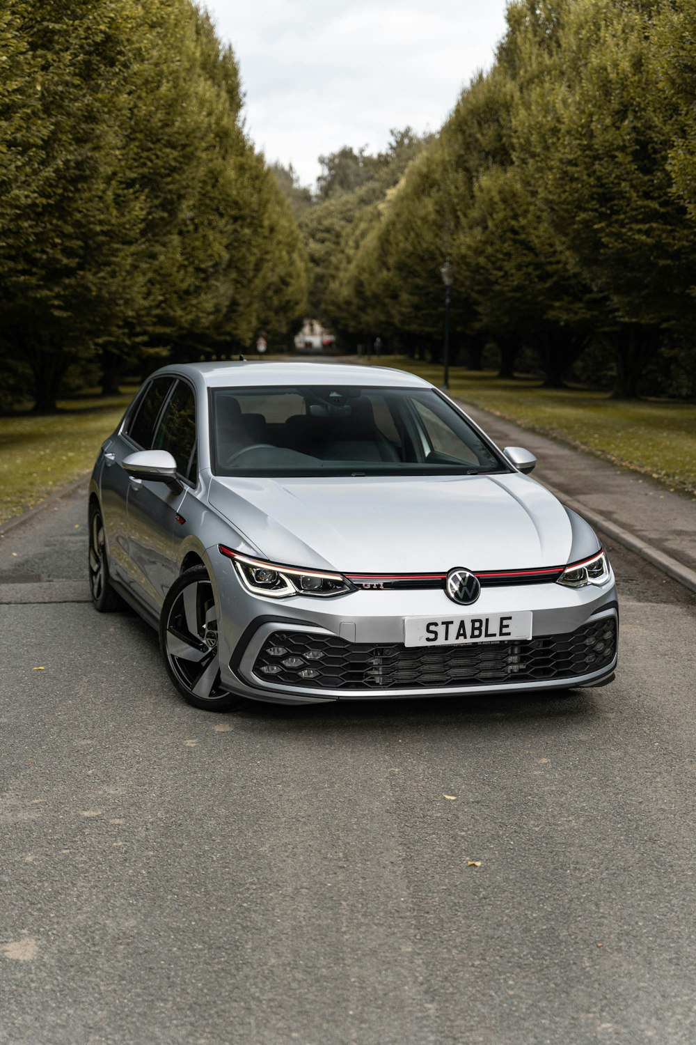 a silver car parked on a road