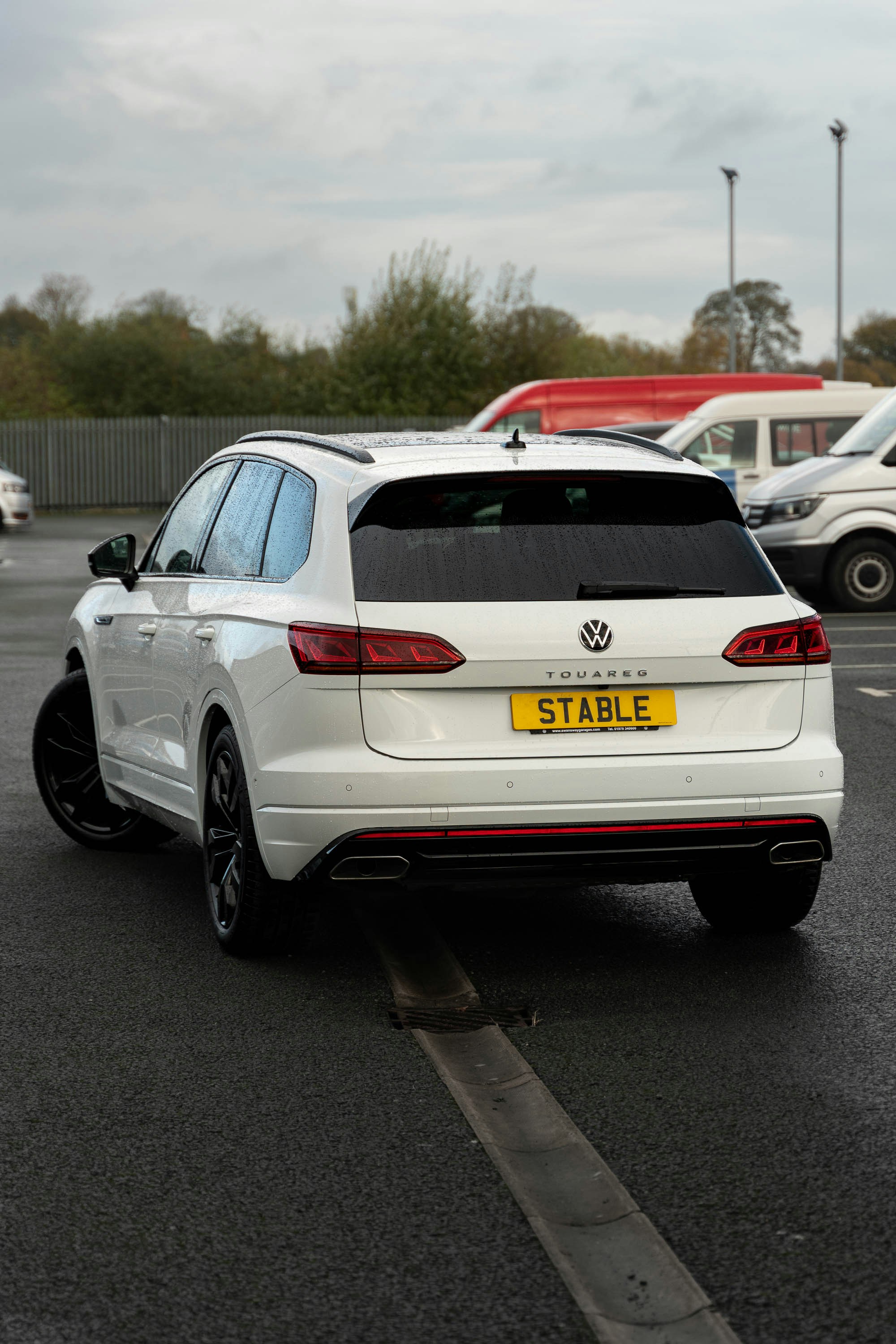 a white car parked in a parking lot