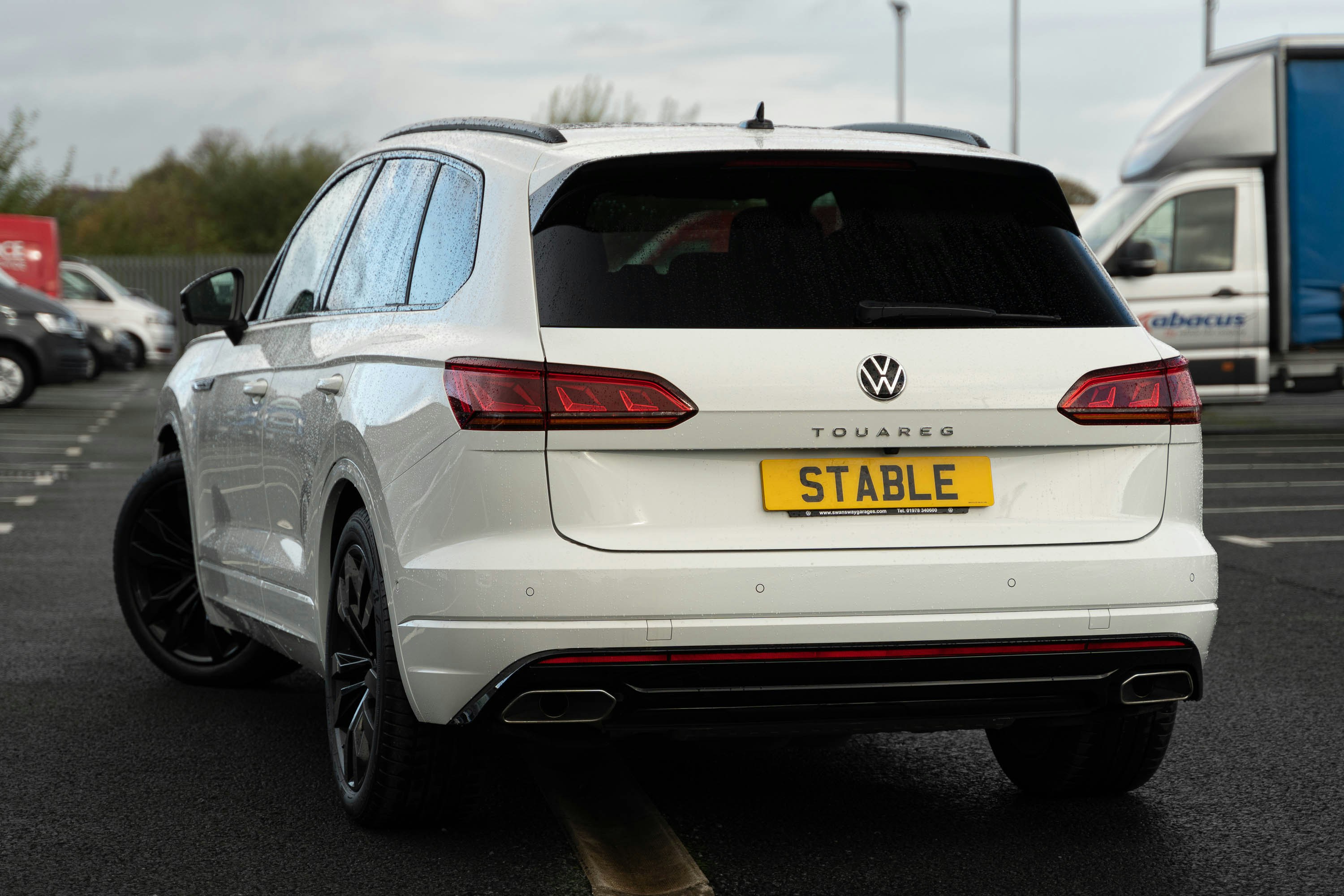 a white car parked in a parking lot