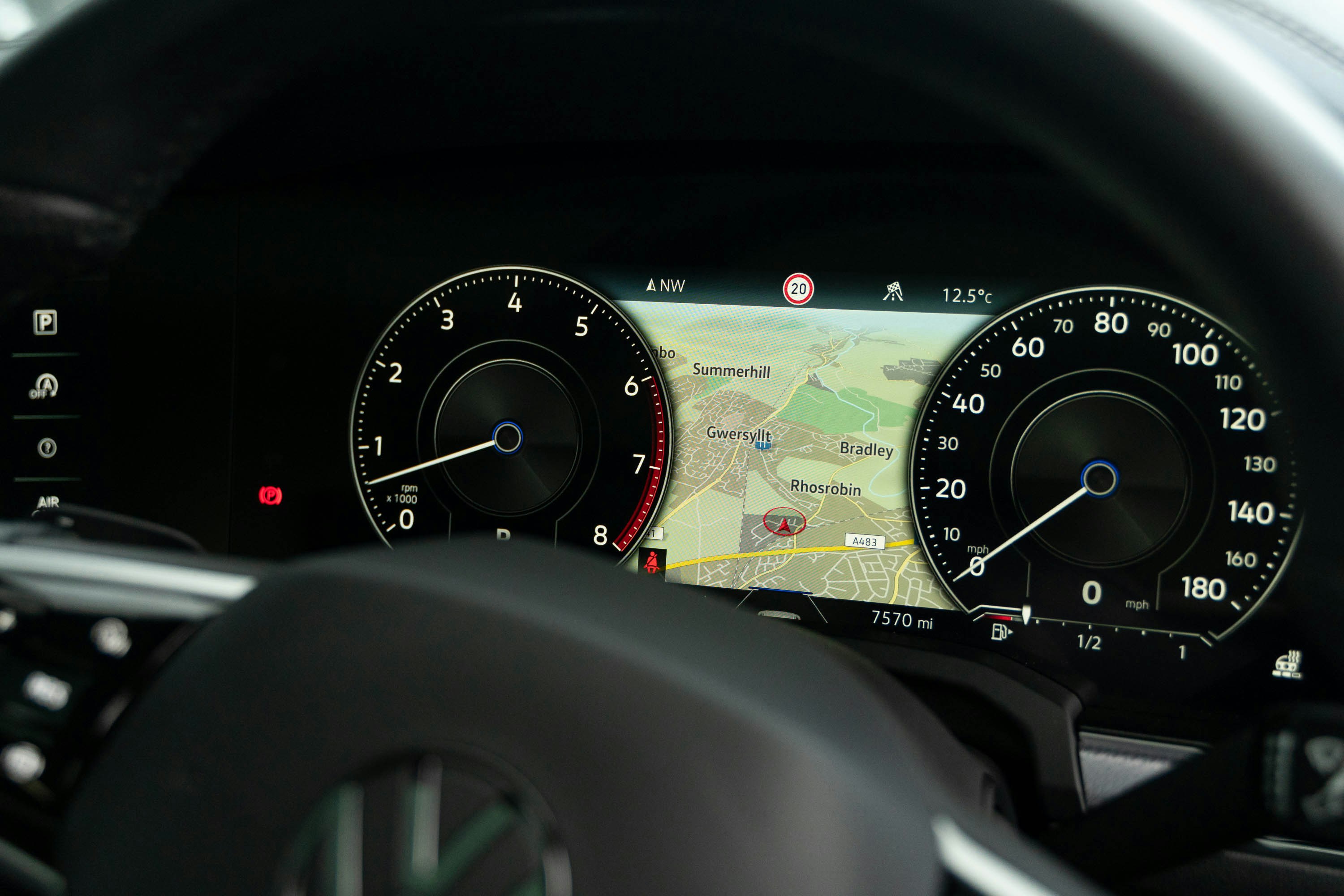 Tesla Model Y interior with large central touchscreen displaying controls and navigation
