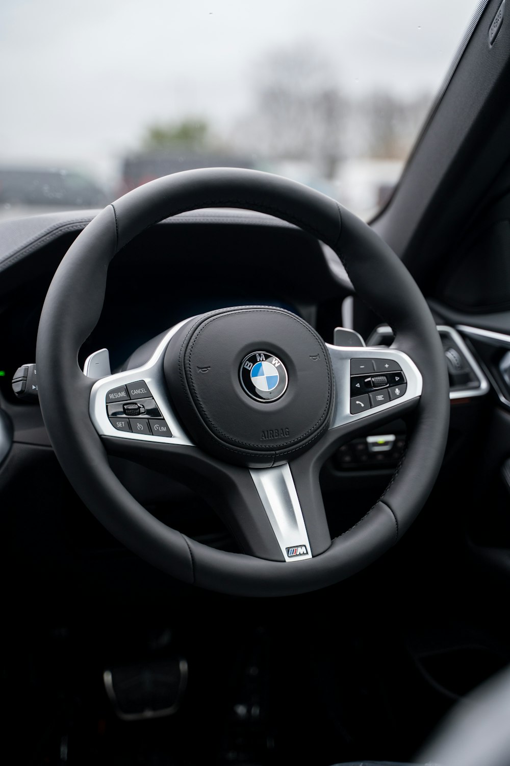 a steering wheel and dashboard of a car