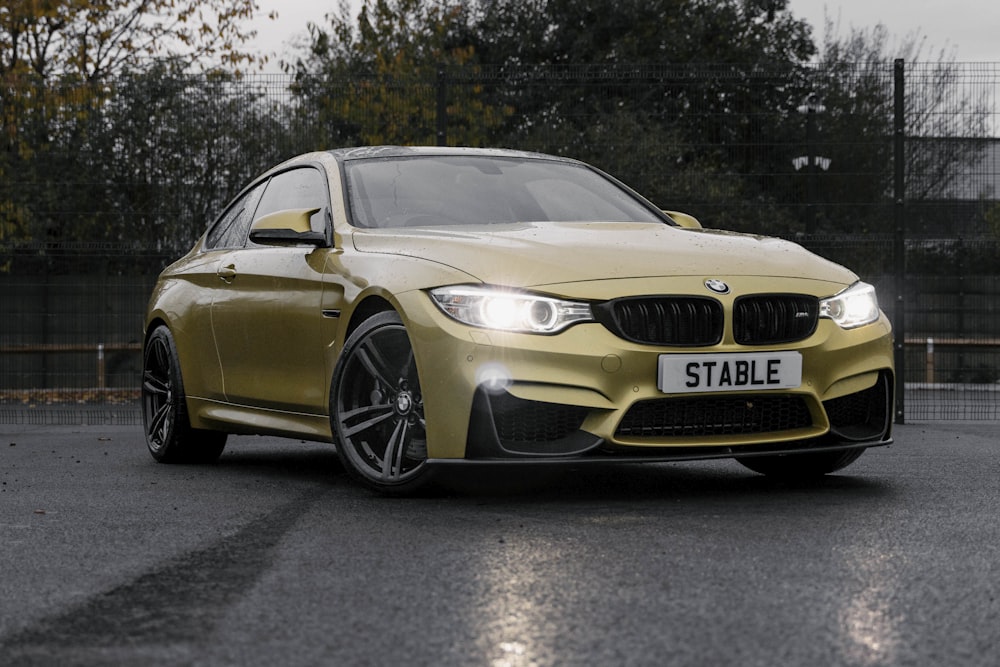 a yellow car parked on a road