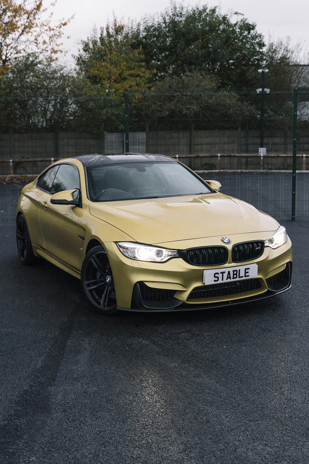 a yellow car parked on a street