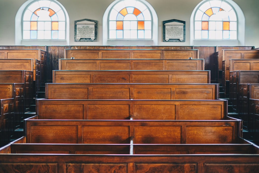 a wooden church with stained glass windows