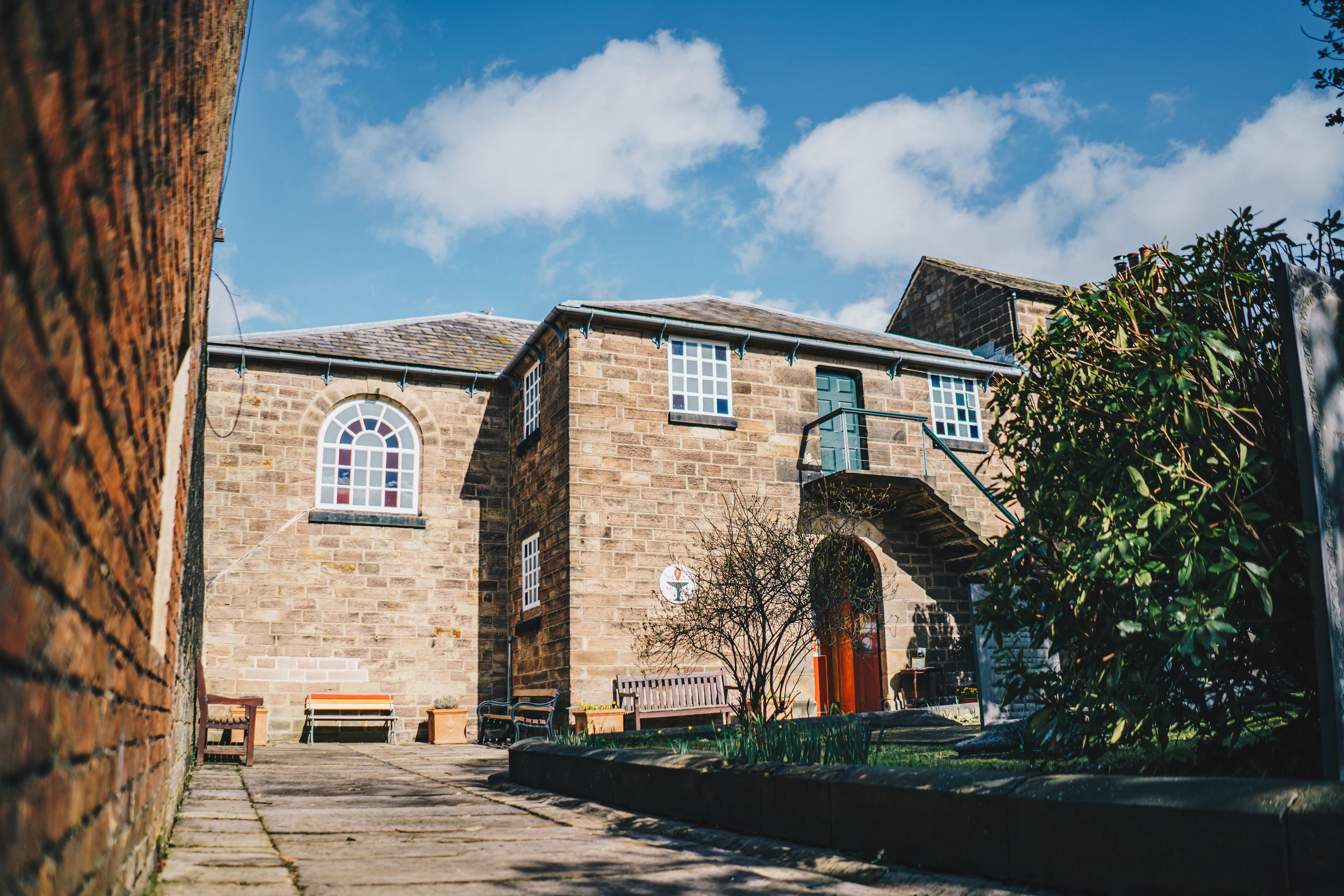 Front of Belper Unitarian Chapel in Derbyshire with its brick walkway