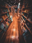 Cozy bookstore interior with shelves full of colorful books and warm lighting.