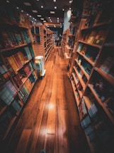 A cozy bookstore corner with a welcoming desk and a friendly staff member ready to assist.