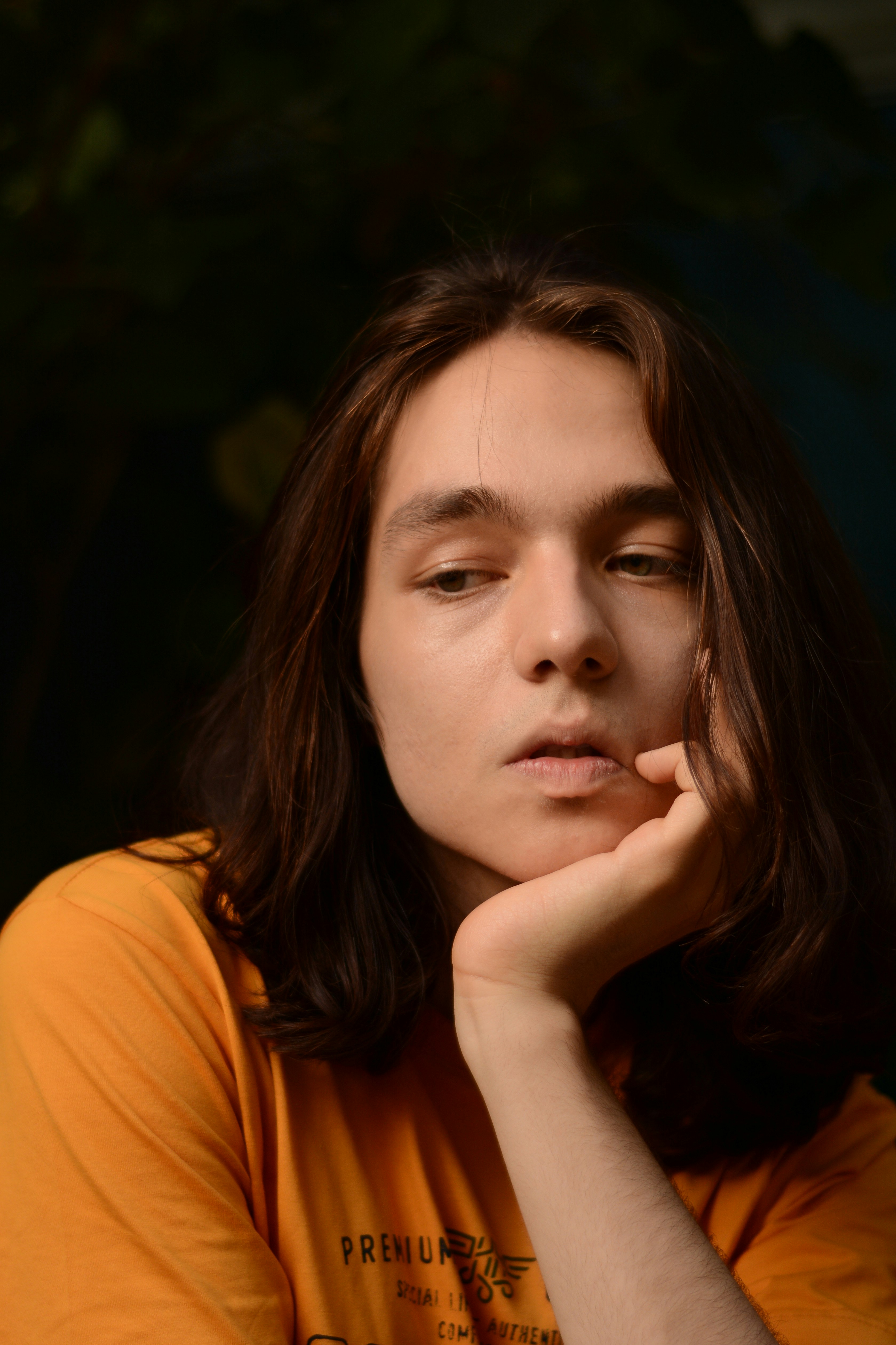 a woman with her hand on her chin