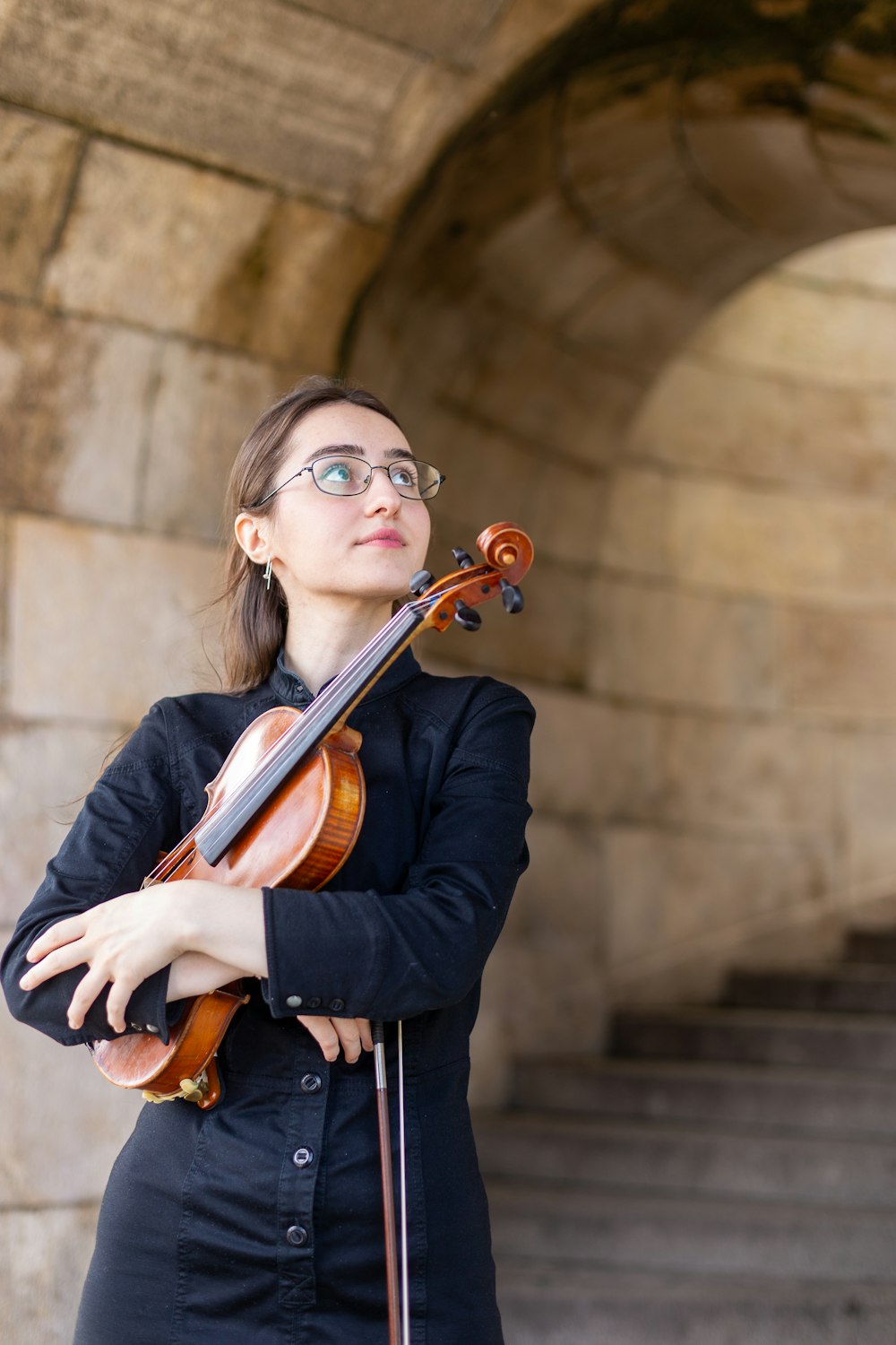 a woman playing a violin