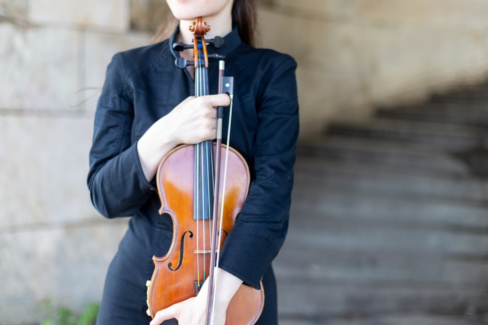 a person playing a violin