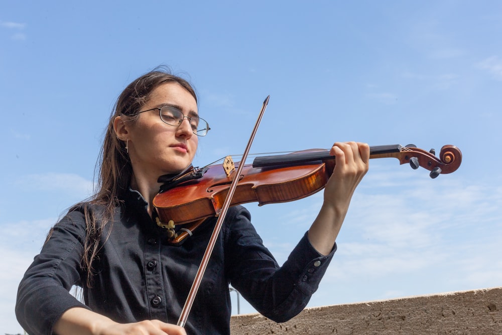 a person playing a violin