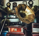 a large brass helmet sits on top of a desk