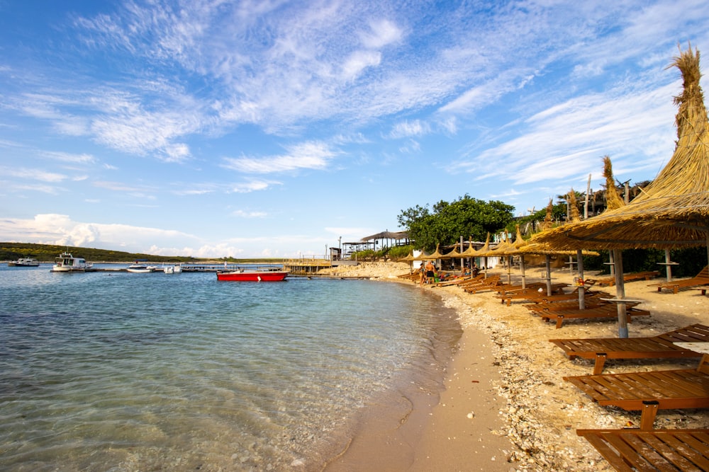 a beach with a boat in the water