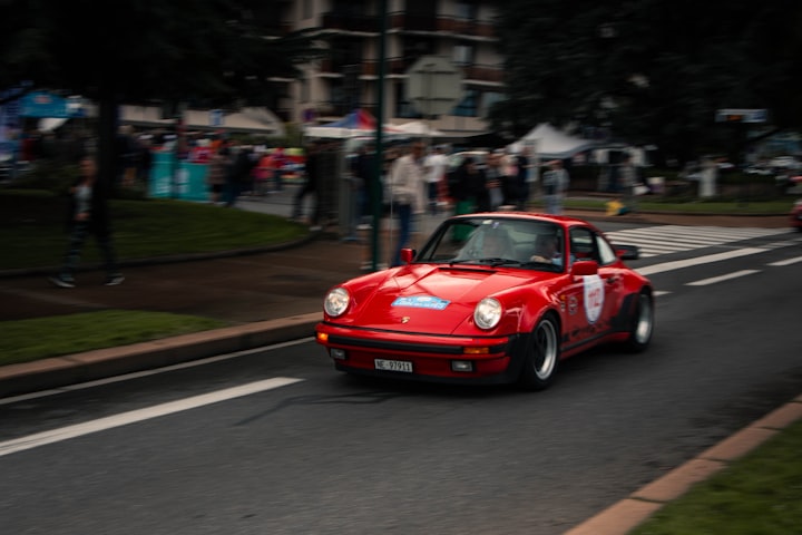 How has Porsche's experience in rally racing influenced its road cars?