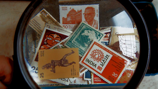 Close-up of a parcel stamped with Indian postal logos ready for dispatch.