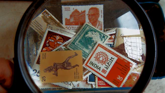 Close-up of rare and collectible stamps with intricate designs and postmarks