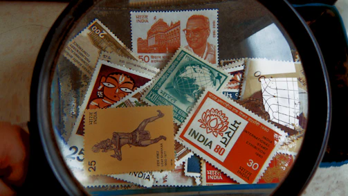 A close-up of a vintage Indian stamp featuring intricate artwork and vibrant colors.