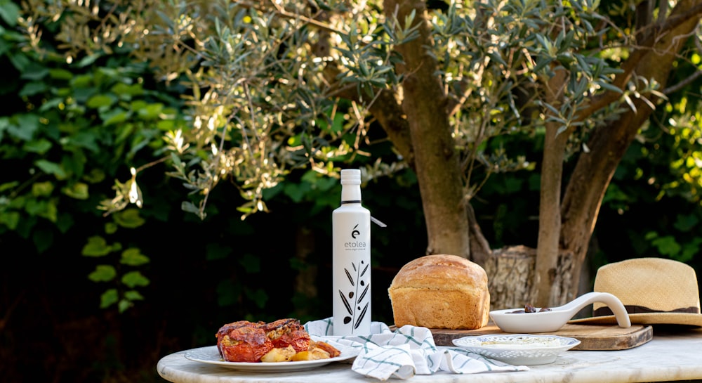 a table with food and a bottle