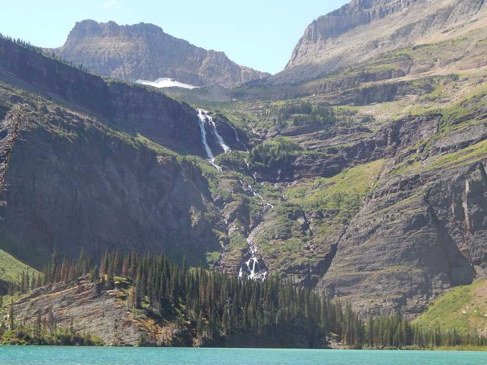 a body of water with mountains around it