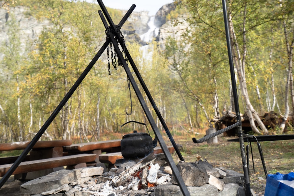 a fire pit with a large metal pipe and a large metal pipe