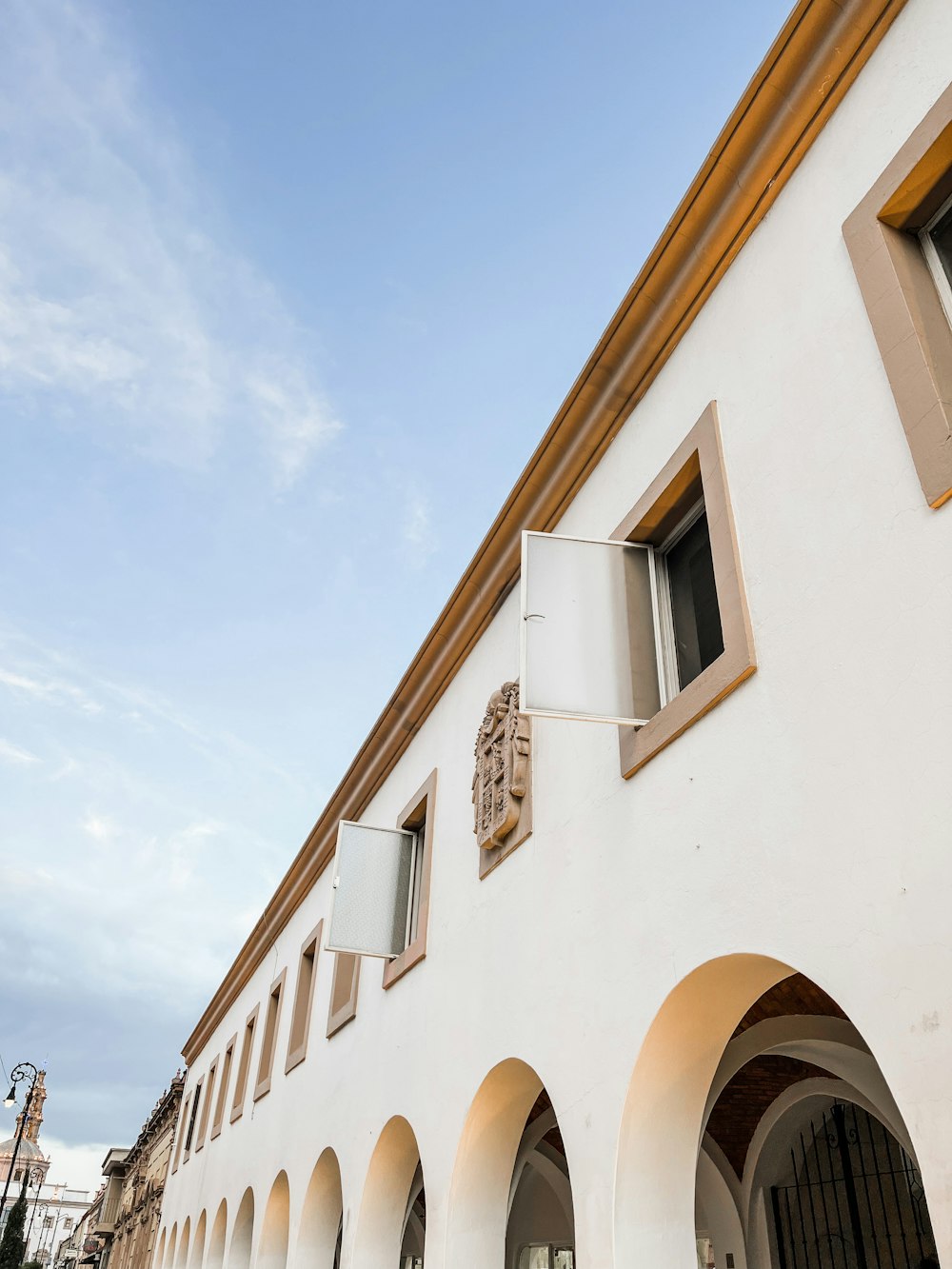 a white building with a clock