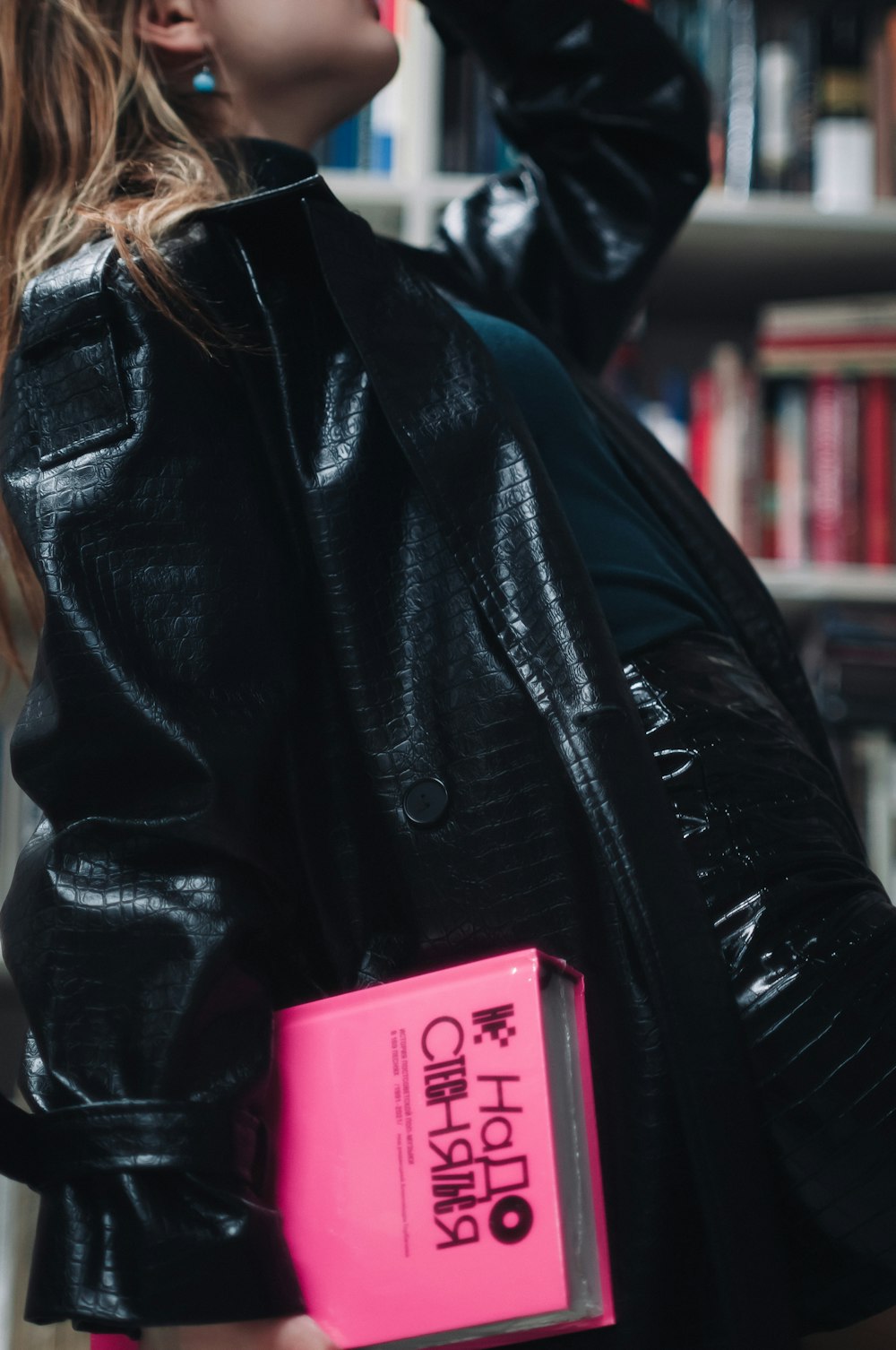 a woman wearing a leather jacket