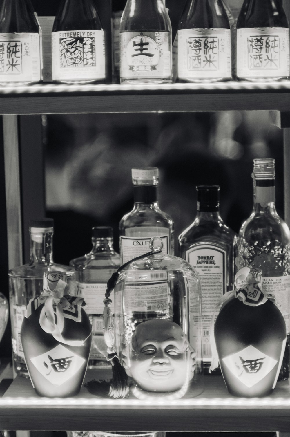 a shelf with bottles of alcohol on it