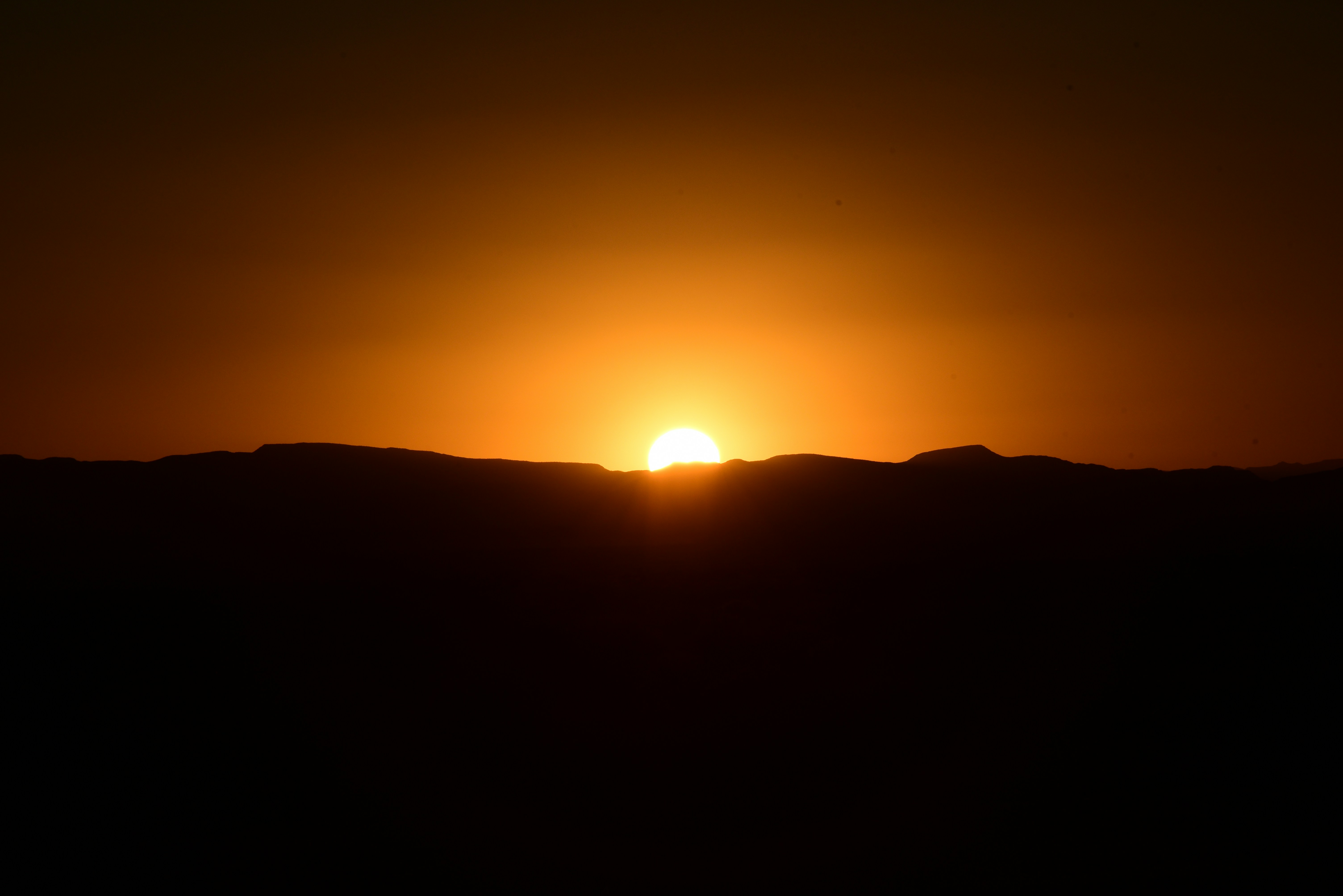 A sunset over a mountain photo Free Van horn Image on Unsplash