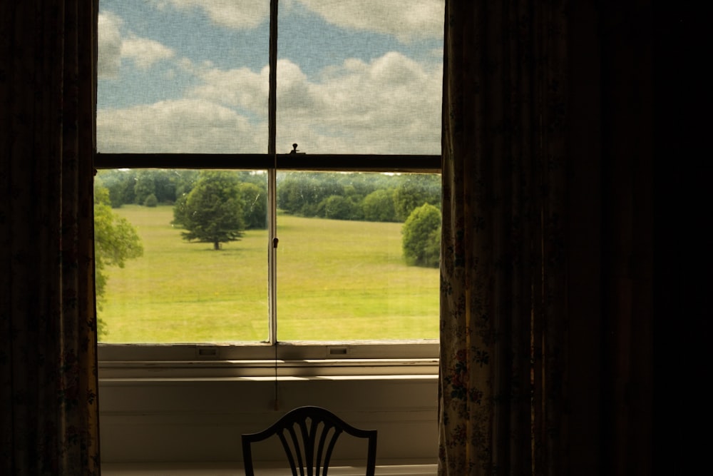 a chair in front of a window