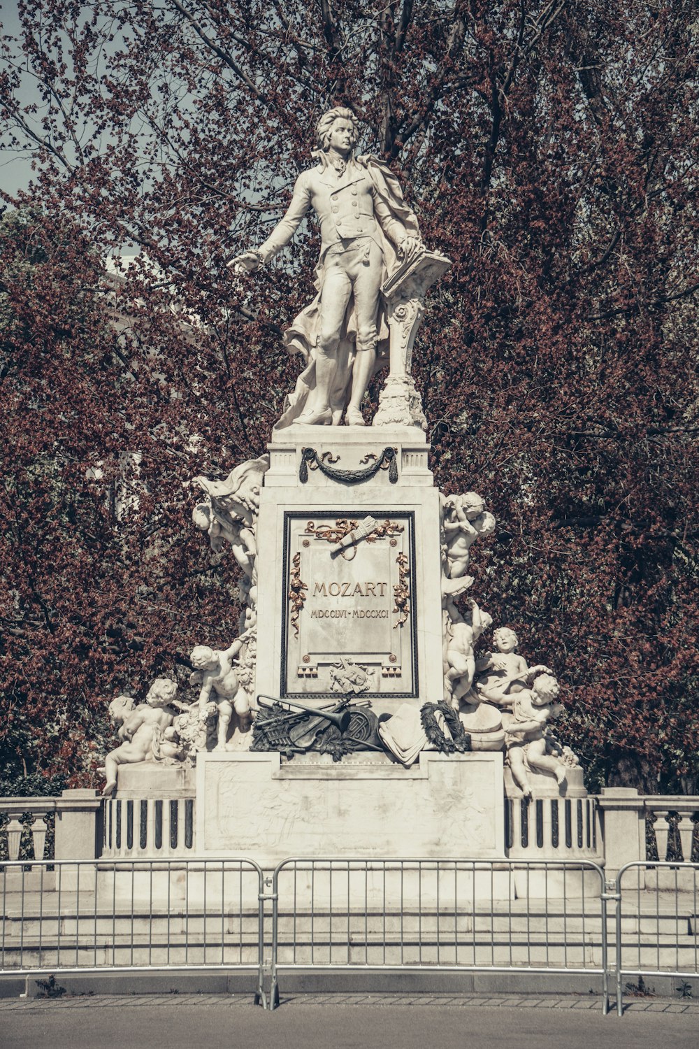 a statue of a person holding a book