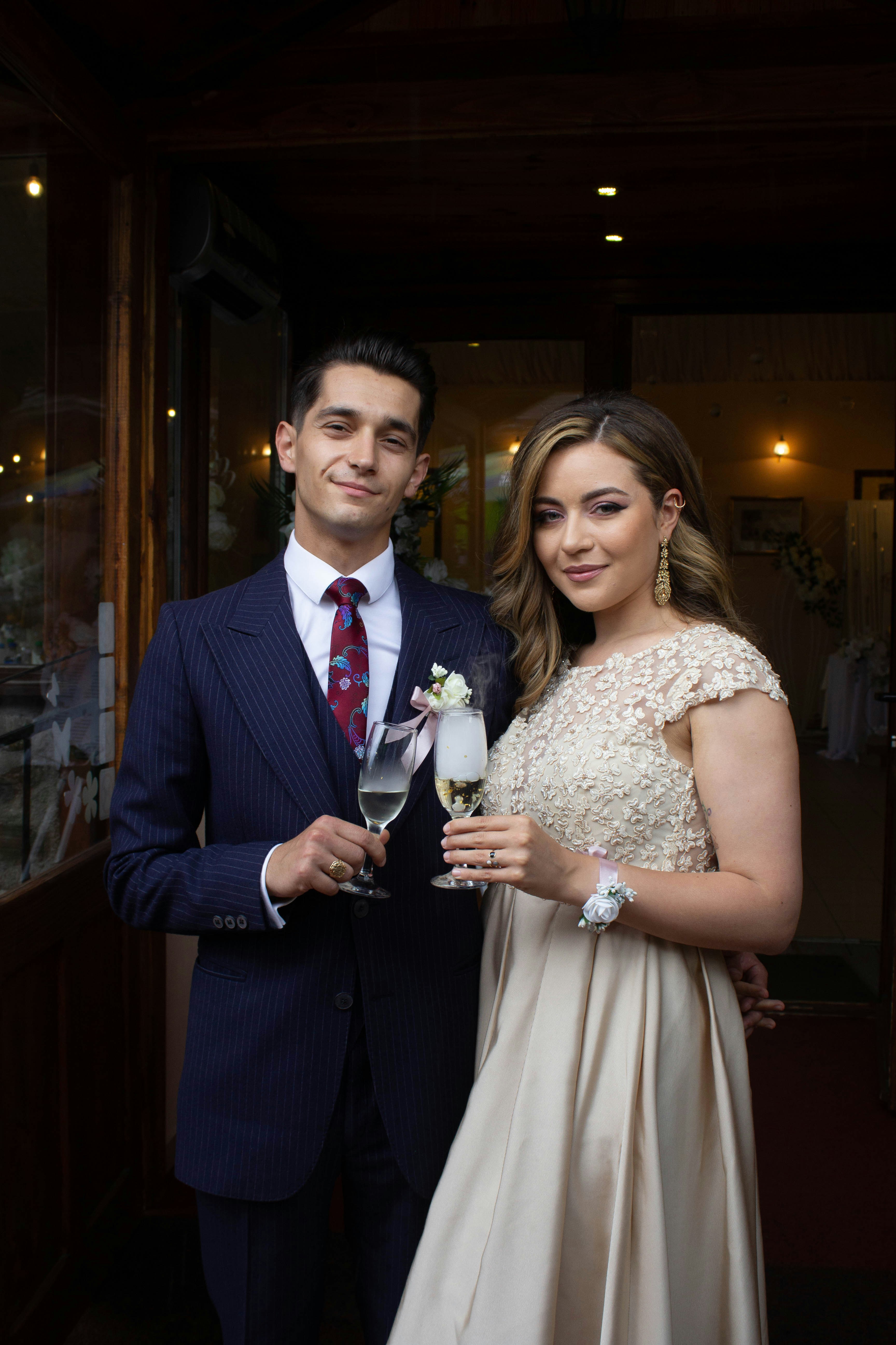 A well-dressed, elegant couple at a formal event
